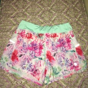 Athleta girl bright floral running shorts.