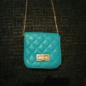 Small hand bag turquoise in color
