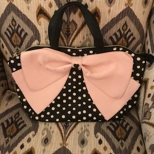 Black and white polka dot purse with pale pink bow