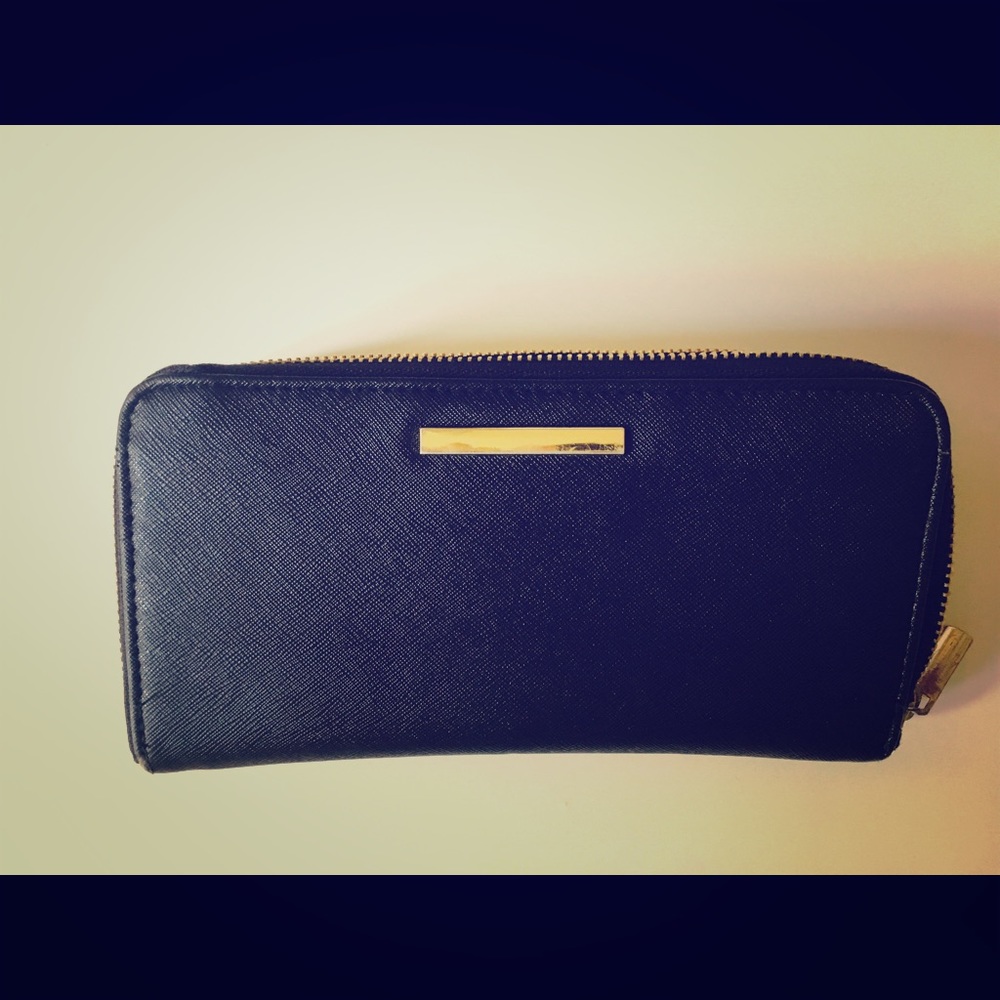 Black wallet with gold accent zipper