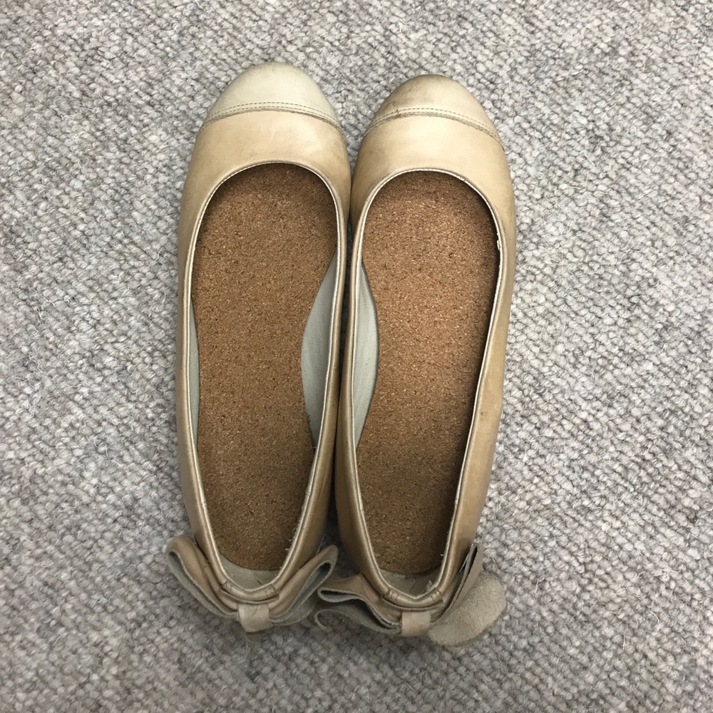 Tan leather flats with bows