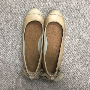 Tan leather flats with bows