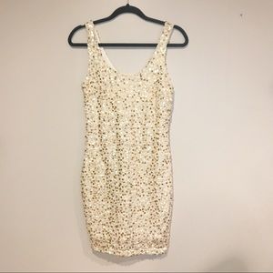 White mini laced dress with gold sequins