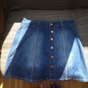 Denim A-line skirt with front buttons.