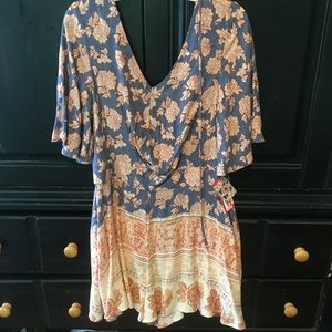 Small Xhilaration romper with pink details