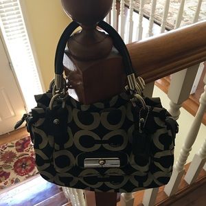 Black and gray Coach purse