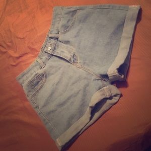 High waisted , loose shorts . Adjustable length .