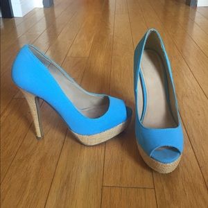 Blue suede peep toe pumps