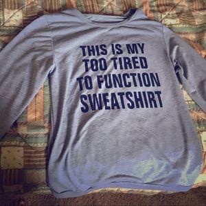 Gray long sleeved shirt with writing