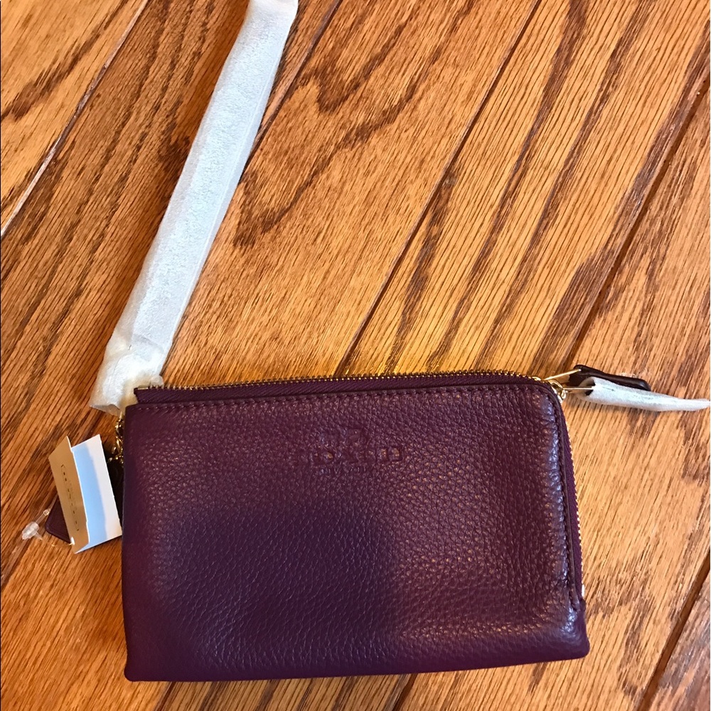 SOLD Plum Coach Wristlet NWT