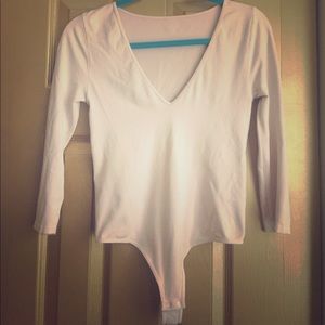 Bebe deep v bodysuit. Size medium. Cream colored.