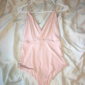 Adorable blush pink bodysuit