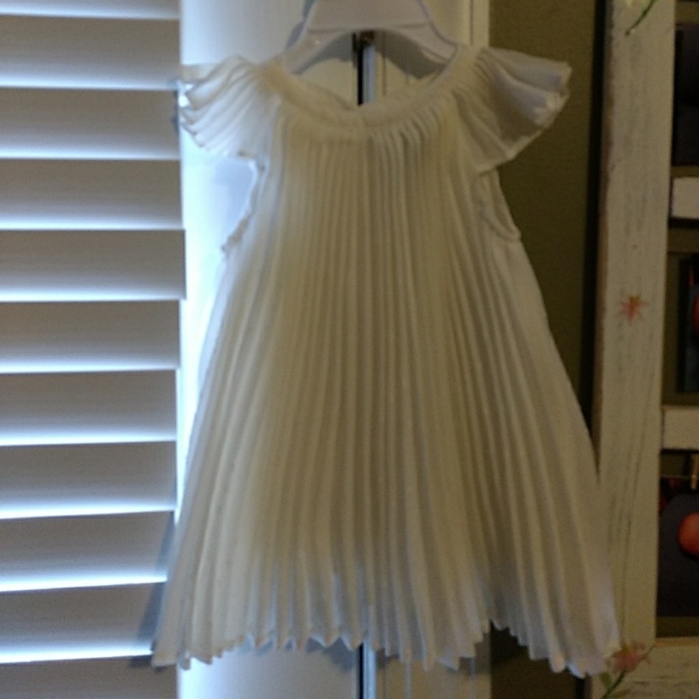 Ivory gown with little fabric pieces for design