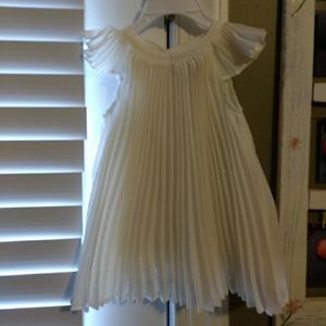 Ivory gown with little fabric pieces for design