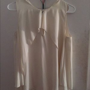 Cream top with button opening for sale!