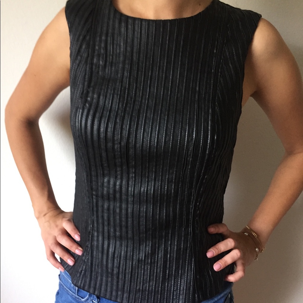 Bebe leather top with a zipper on a back