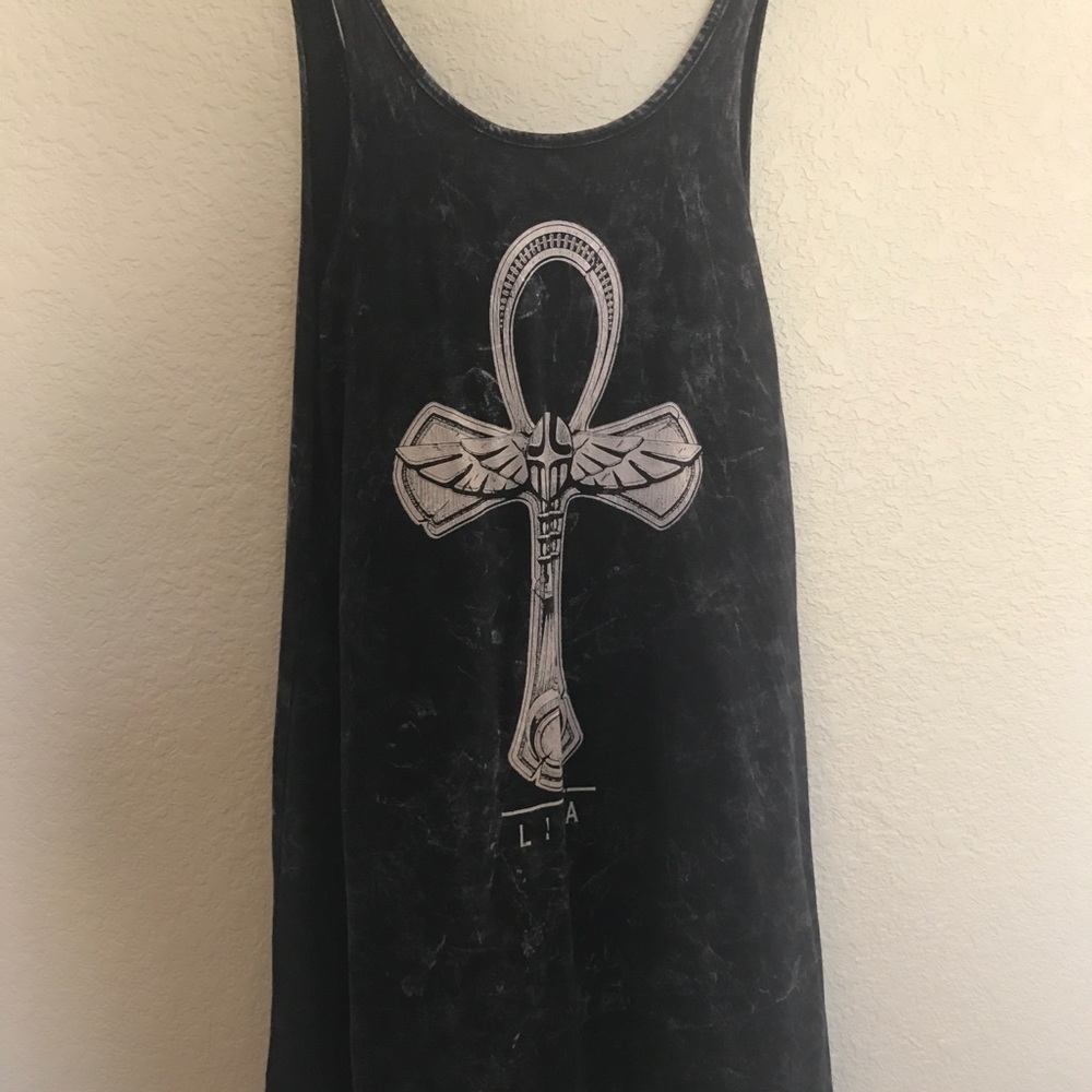 black loose dress with a cross.