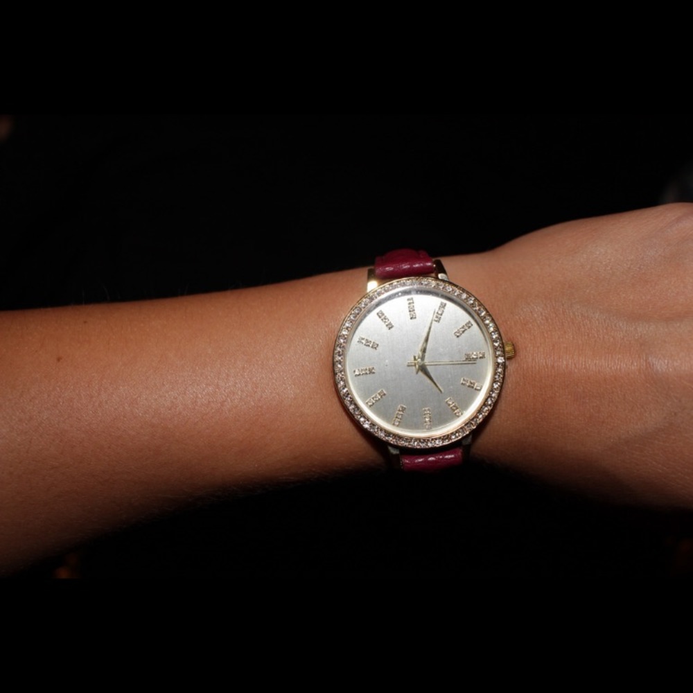 Never worn red faux leather band gold watch