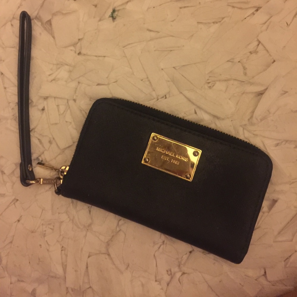 Michael Kors wristlet in black and gold