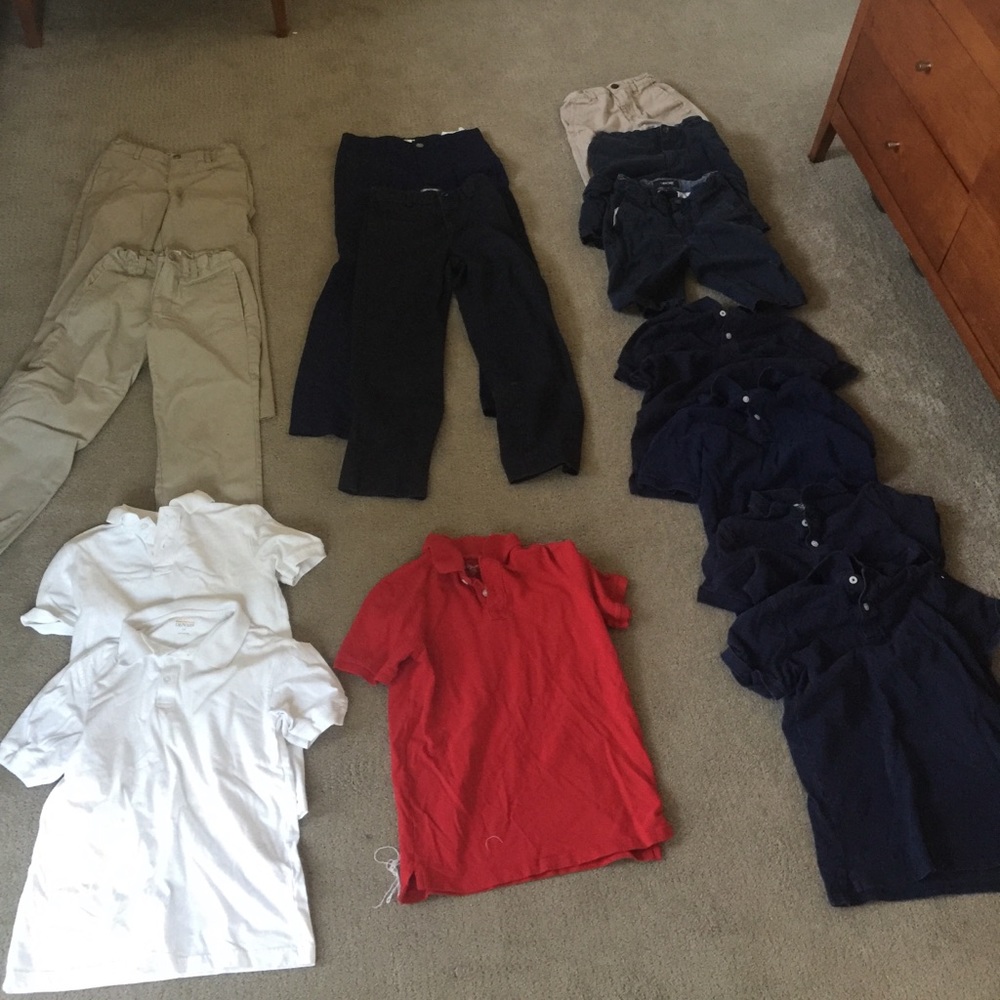 Lot of boys school uniform clothing.