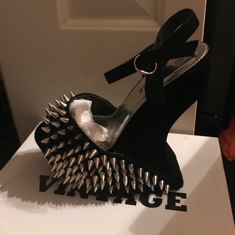 Black studded heels .