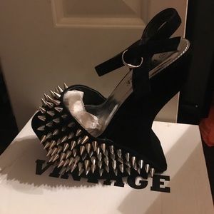 Black studded heels .