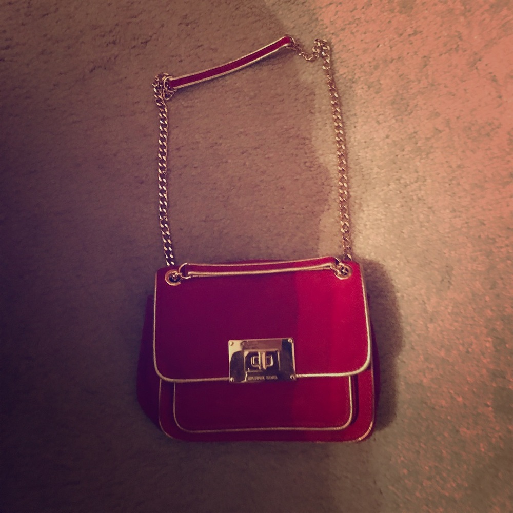 Red and gold Michael Kors satchel