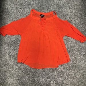 Orange top with the shoulders cut out