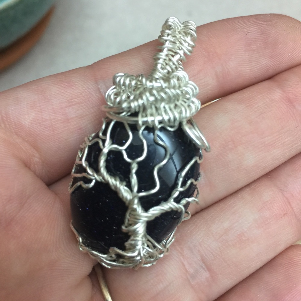 Silver goldstone pendant