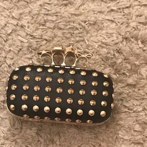 Black studded knuckle clutch