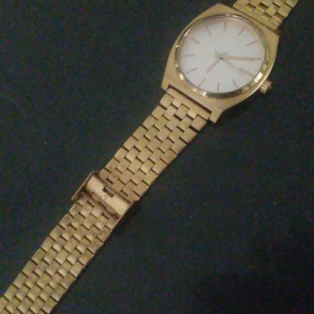 Gold nixon watch