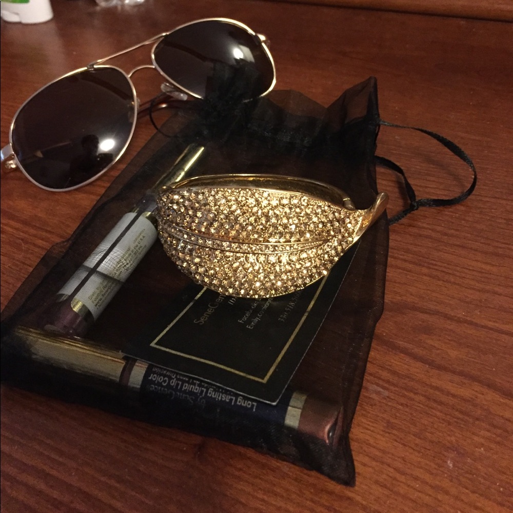 Gold rhinestone studded spring loaded cuff