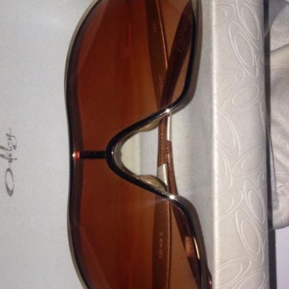 Gold Oakley women's sunglasses