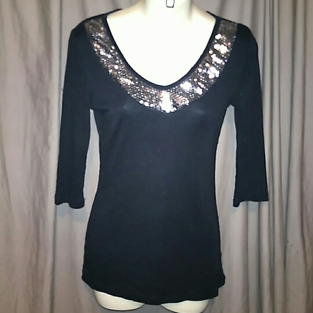 Like new sequenced half sleeve top.