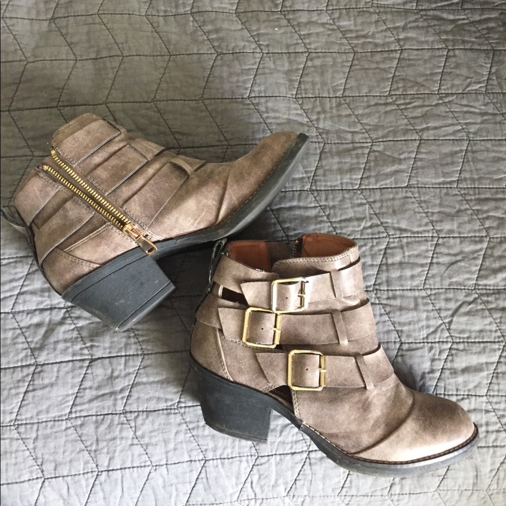 Report ankle boots with gold buckles