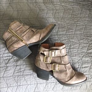 Report ankle boots with gold buckles