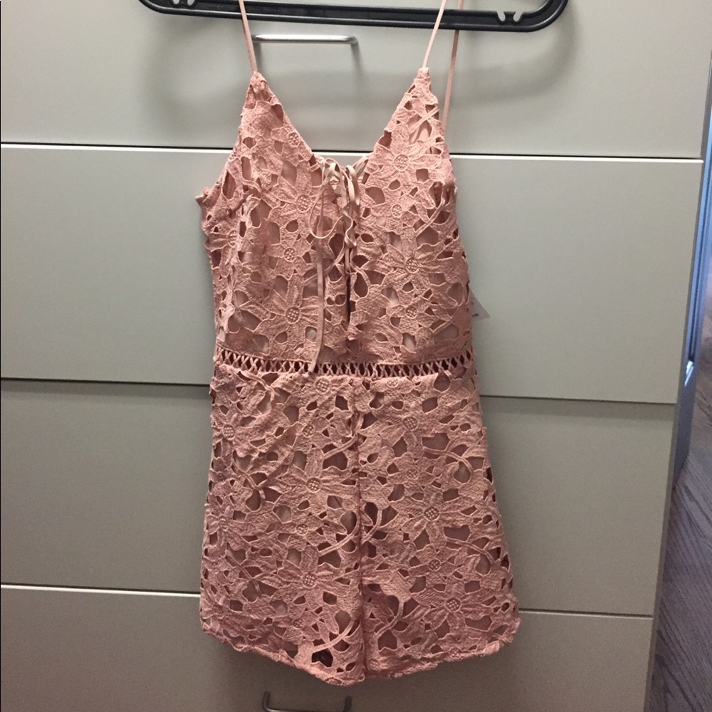 Adorable light pink/blush lace up romper