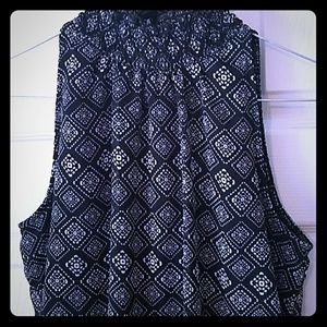 Sleeveless,  high neck  with little ruffle