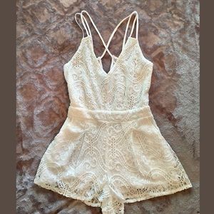 White, lace romper from Pacsun.