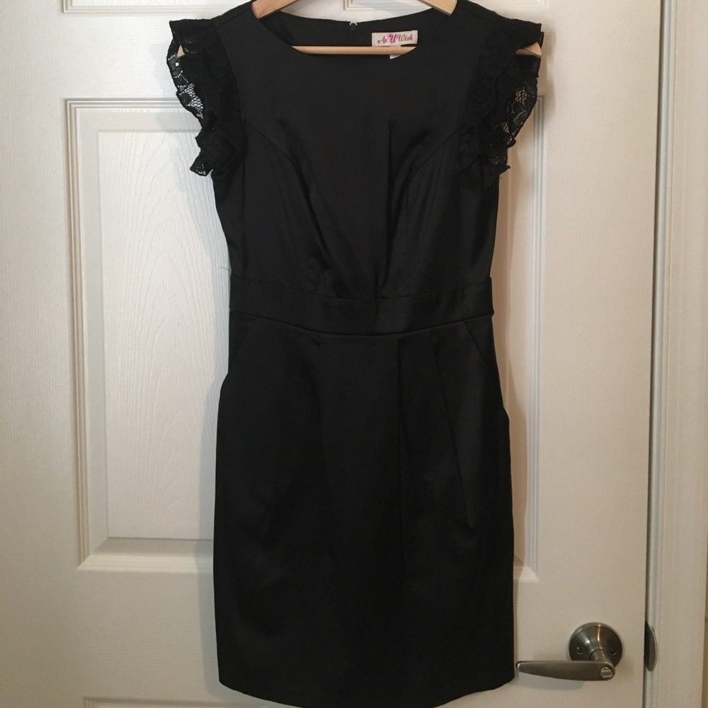 Little black dress with ruffled sleeves