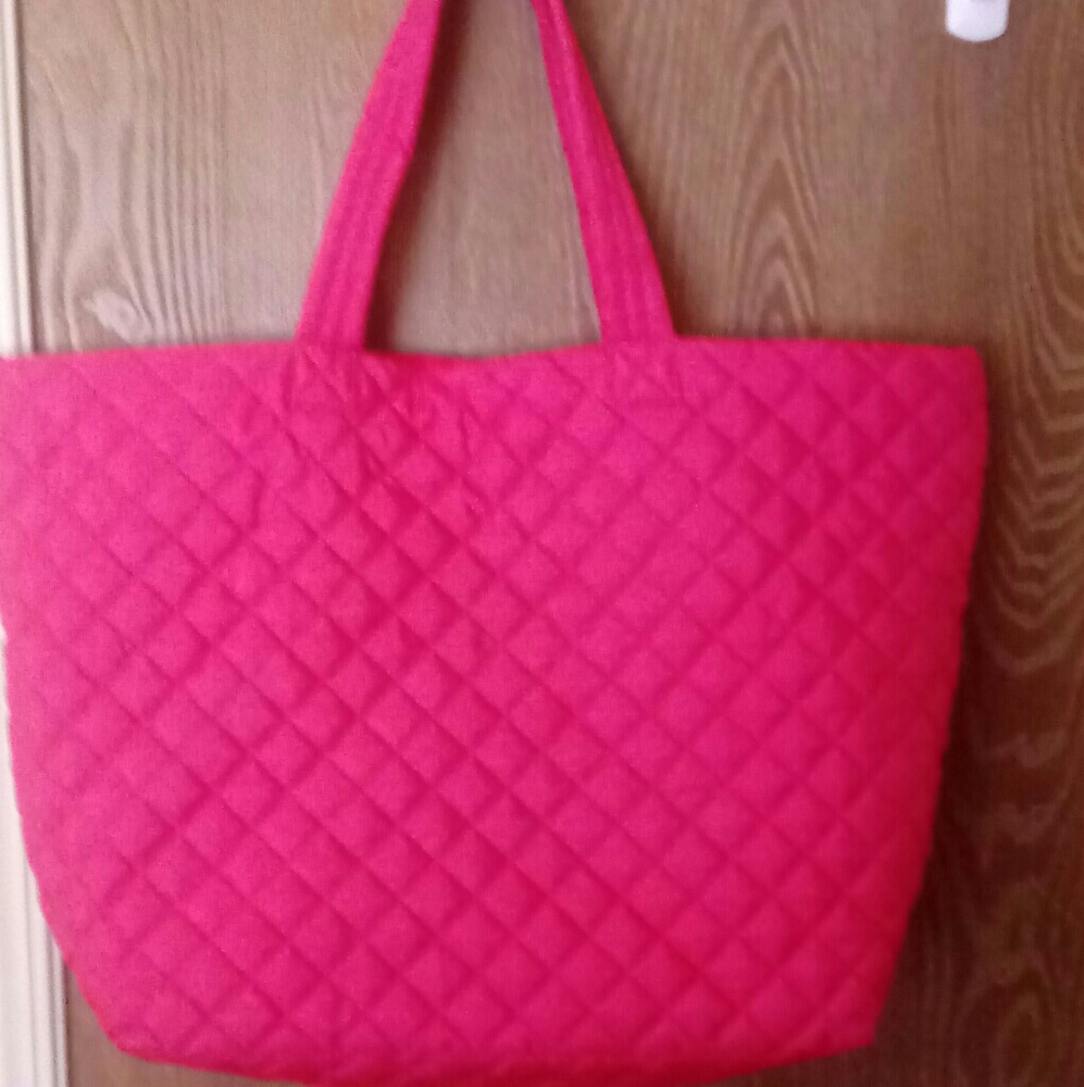 Large quilted like hot pink bag with orange inside