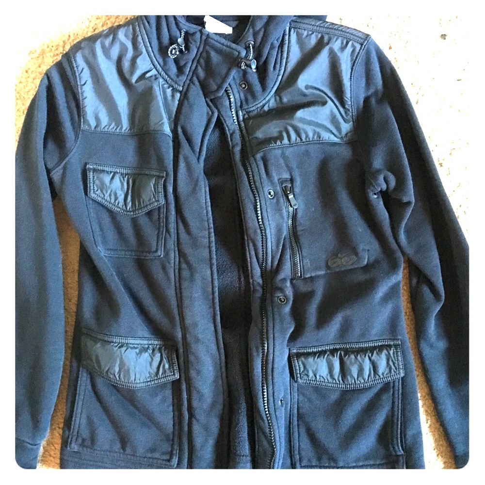Nike XS zip up jacket. Black in color.