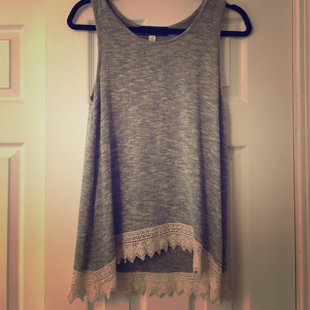 A laced bottom sleeveless top