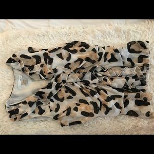 Sexy but modest leopard blouse for work.