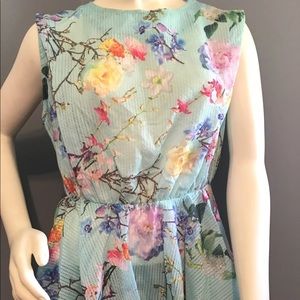 GRACIA FLORAL PEPLUM TOP WITH OPEN BACK SZ M
