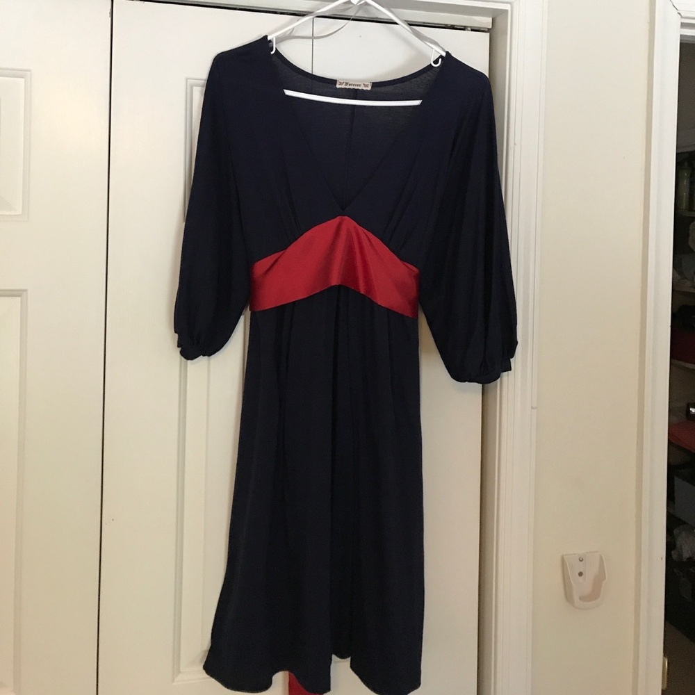 Navy Blue cocktail dress with a red, satin tie.