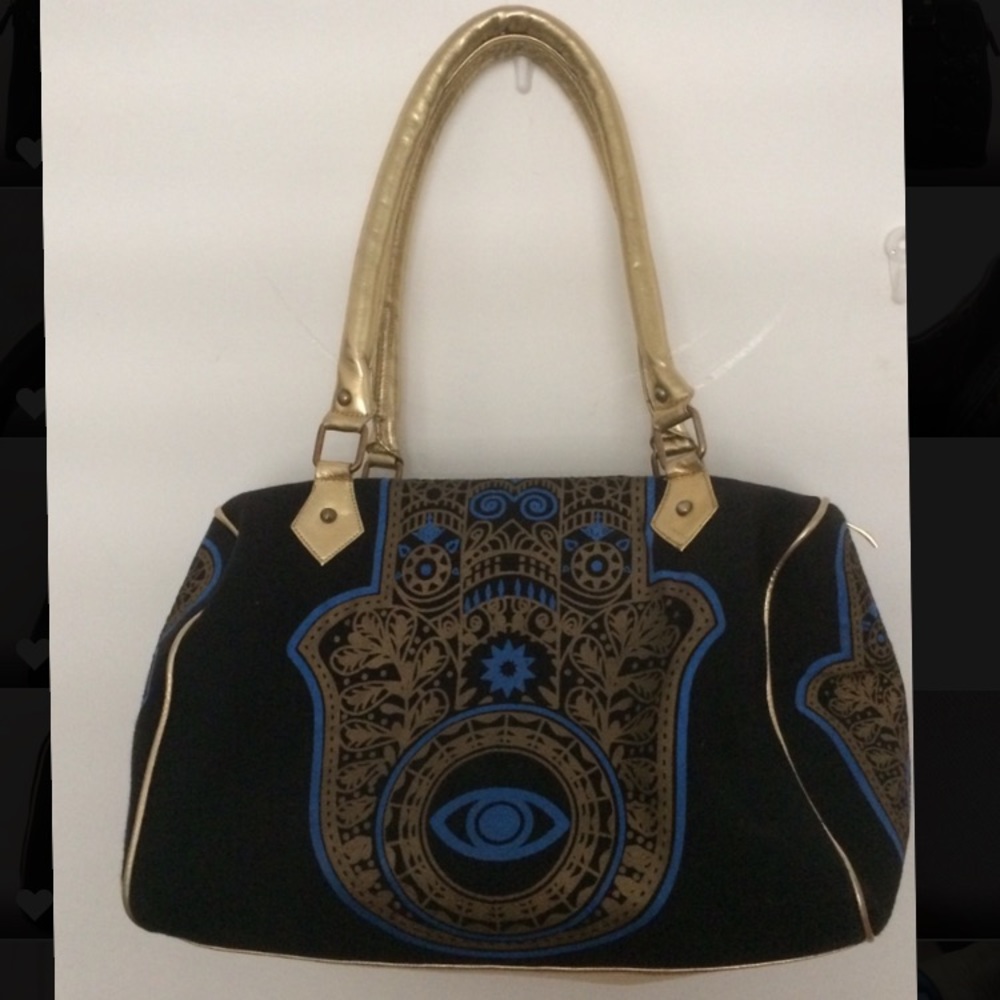Hamsa handbag 👜 with hamsa detail.