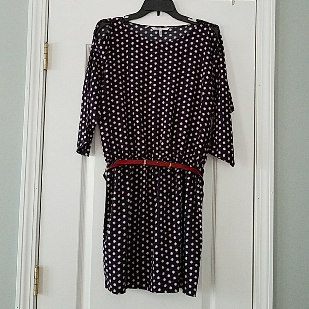 Navy, purple and cream dress with red belt.