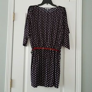 Navy, purple and cream dress with red belt.