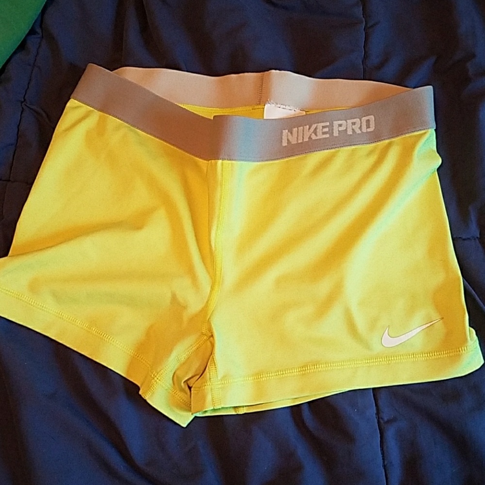 Neon yellow women's nike DRI-FIT spandex shorts
